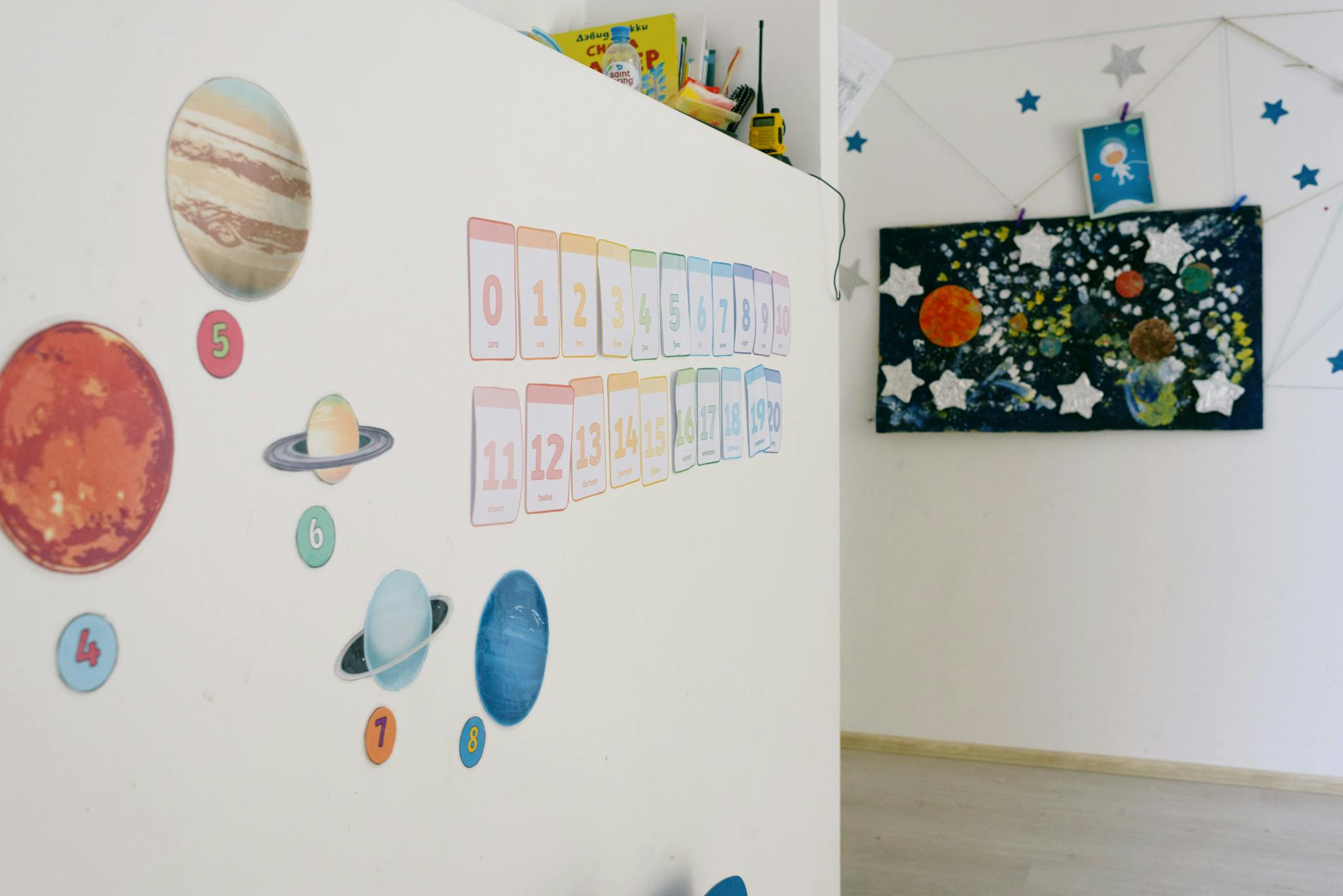 Educational wall decor featuring planets and numbers in a classroom setting.